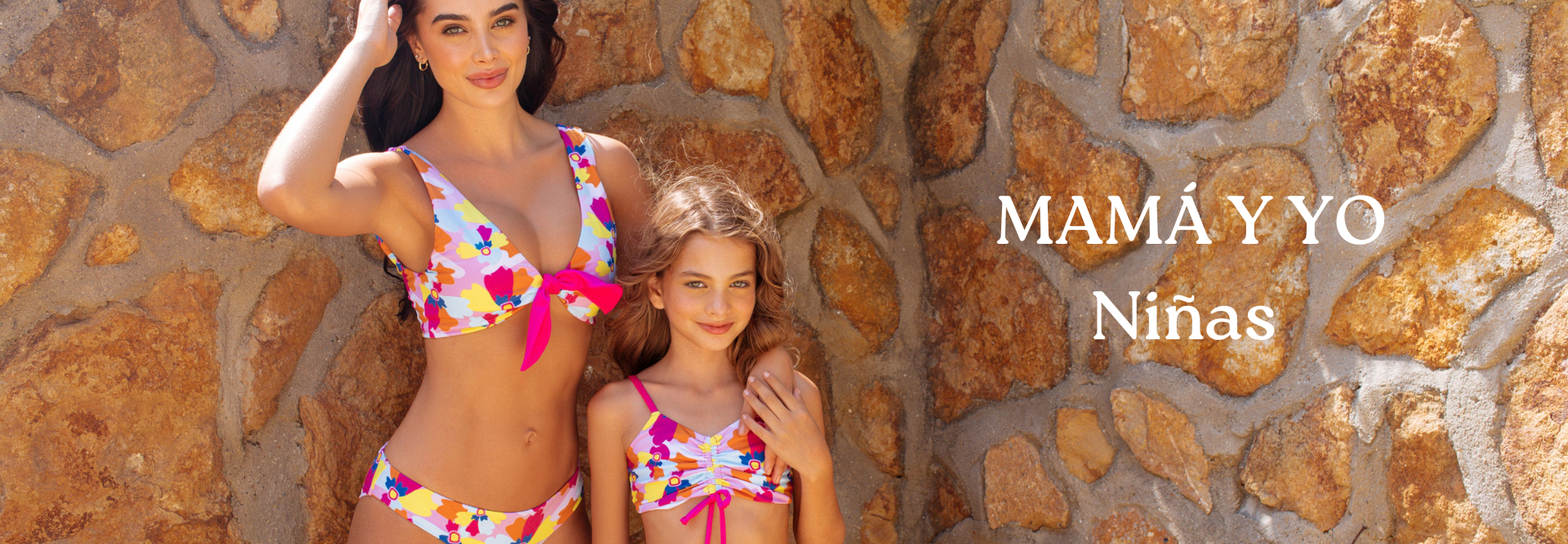 mother and daughter wearing matching swimsuits